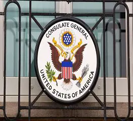 A sign with an eagle and the words consulate general united states of america.