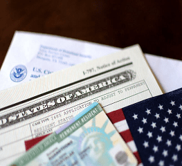 A close up of some papers and an american flag