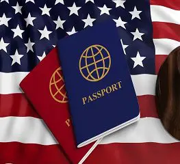 Two passports sitting on top of a flag.