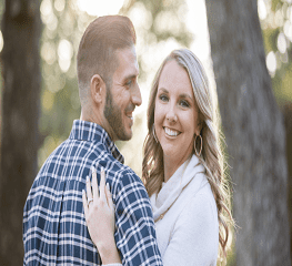 A man and woman smiling for the camera.