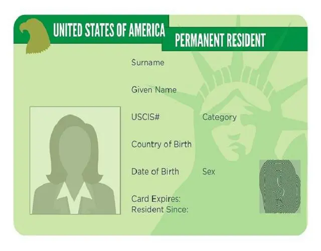 A green card with the name of someone and nationality.